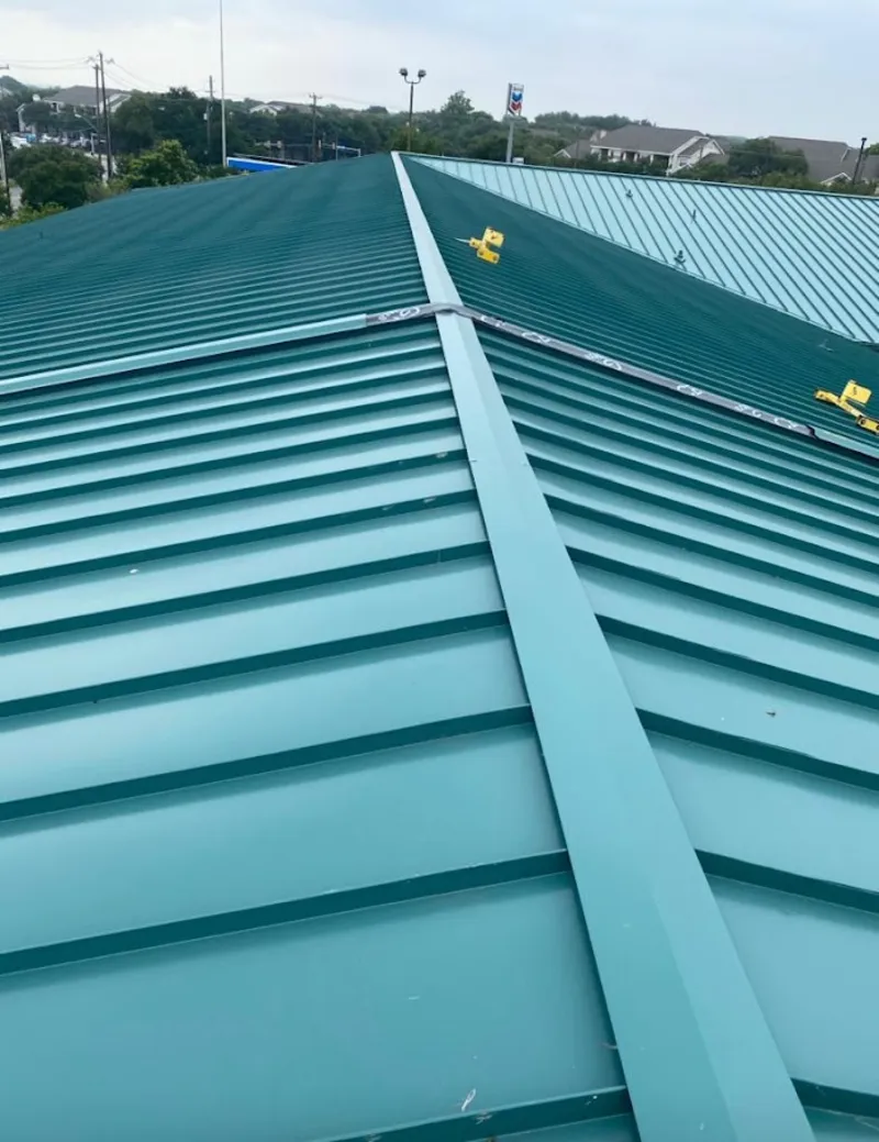 Green commercial metal roof ridge and valley for Metal Roof Repair in Verona